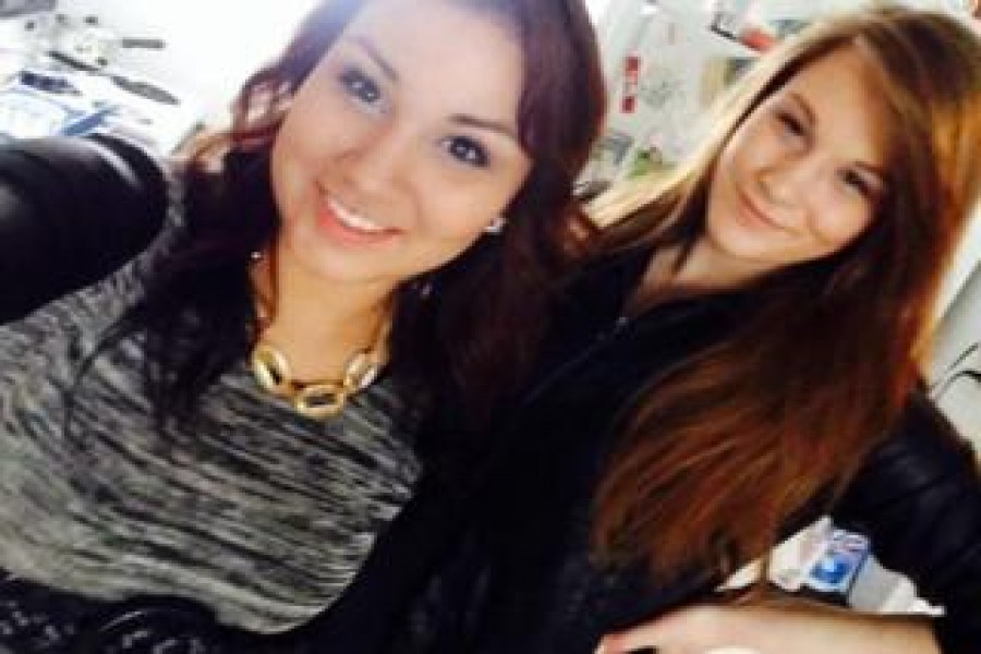 A belt worn by Cheyenne Antoine (L) can be seen as she poses with victim Brittney Gargol. -BBC