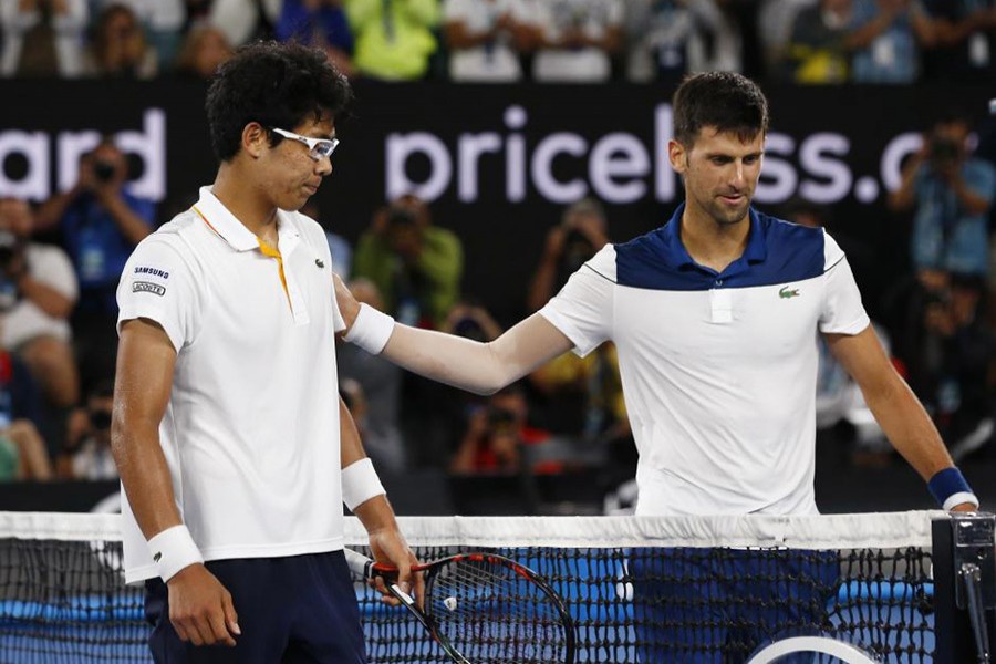 Serbia's Novak Djokovic (R) congratulates South Korea's Chung Hyeon for his stunning performance in clash against him.