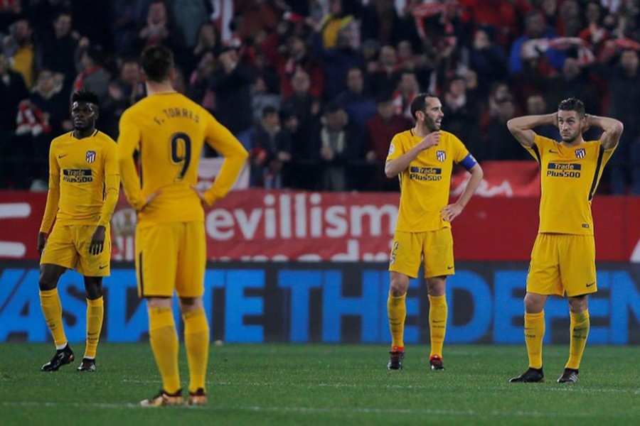 Atletico Madrid players cut a dejected figure after conceding their third goal. - Reuters photo