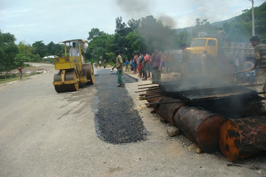 Workers carrying out maintenance work on Sylhet-Tamabil-Jaflong road under Sylhet Road Division. - RHD file photo