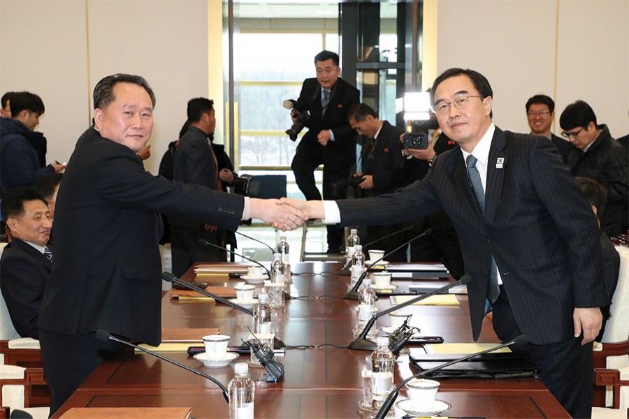 Head of the North Korean delegation Ri Son Gwon shakes hands with his South Korean counterpart Cho Myoung-gyon at the truce village of Panmunjom in the demilitarized zone in South Korea on January 09, 2018. — Photo: Reuters