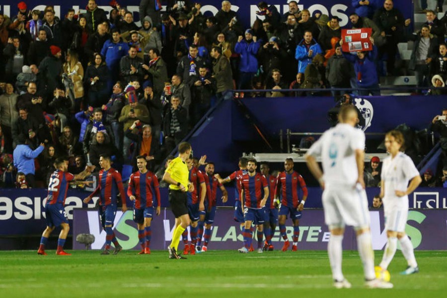 Real Madrid players look dejected as Levante celebrate late equaliser during Saturday's encounter. - Reuters photo