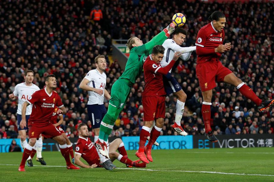 Premier League - Liverpool vs Tottenham Hotspur - Anfield, Liverpool, Britain - February 4, 2018 Liverpool's Loris Karius in action with Tottenham's Dele Alli. (Reuters)