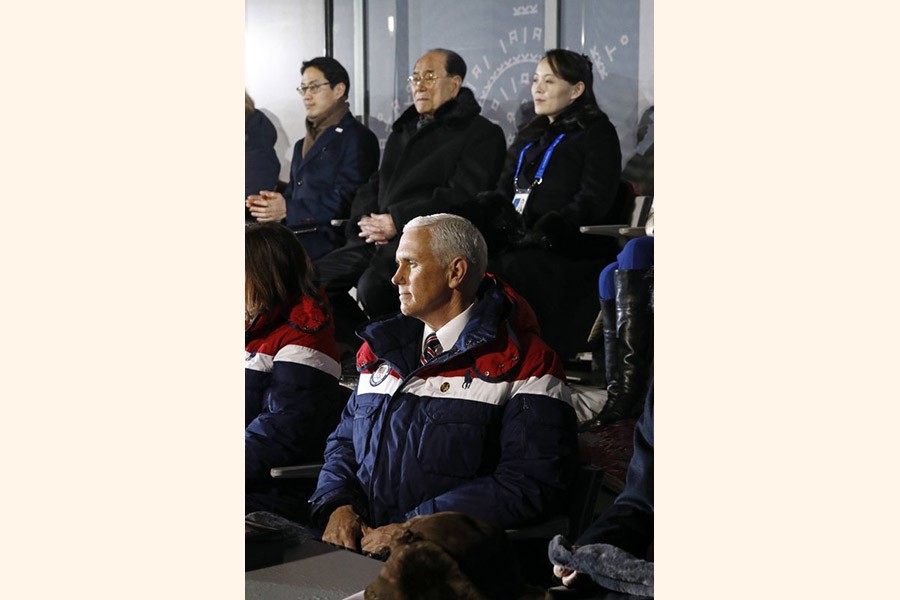 Vice President Mike Pence, bottom, watches the opening ceremony of the 2018 Winter Olympics in Pyeongchang, South Korea, Friday, Feb. 9, 2018. Seated behind Pence are Kim Yo Jong, top right, sister of North Korean leader Kim Jong Un. –AP Photo