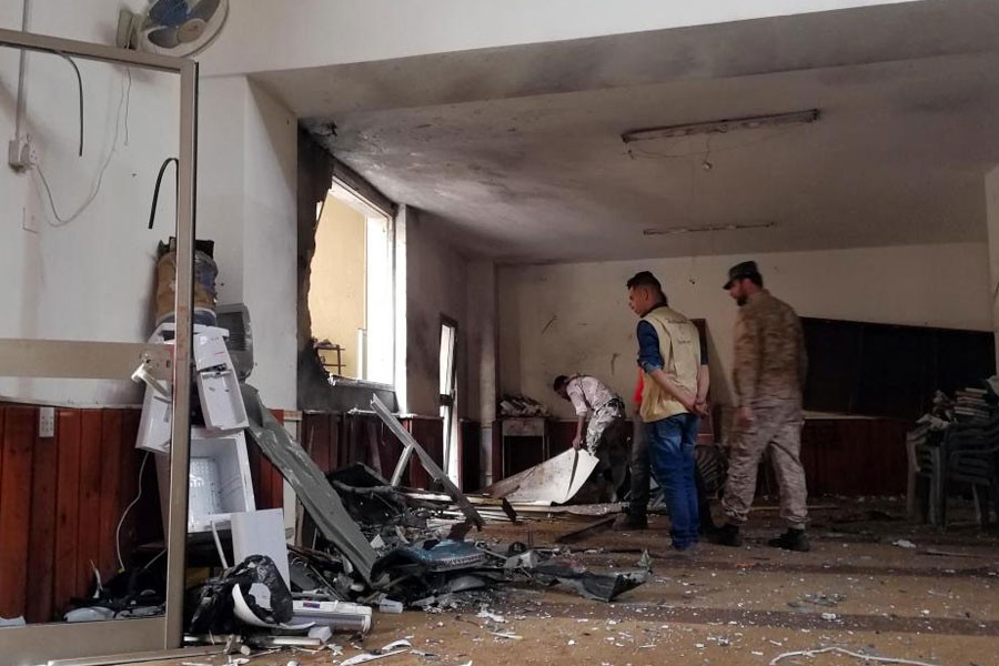 People inspect the damage inside a mosque following a twin bombing in Benghazi, Libya February 9, 2018. (REUTERS)