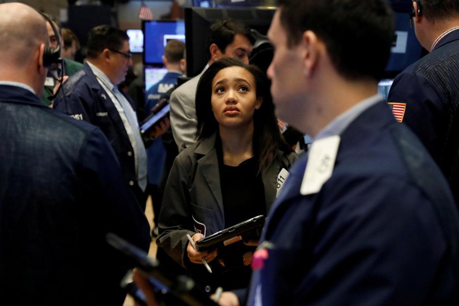 Traders work on the floor of the New York Stock Exchange shortly after the opening bell in New York, US, February 16, 2018. Reuters/File Photo