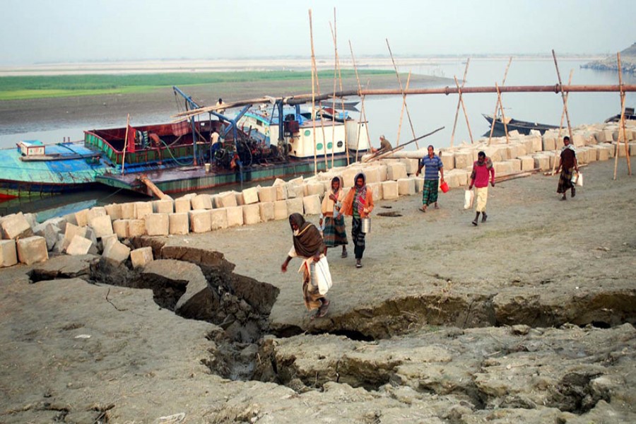 Unabated sand lifting from the Jamuna affected a vast area of Dhunot upazila in Bogra. 	— FE Photo