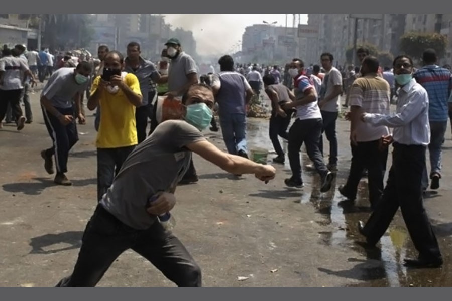 Members of the Muslim Brotherhood throw stones at riot police and army personnel during clashes in Cairo. (Reuters photo used for representation)