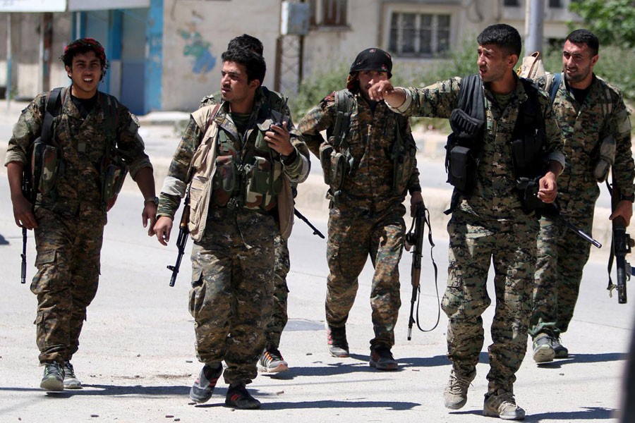 Kurdish fighters from the People's Protection Units (YPG) walk along a street in the southeast of Qamishli city, Syria, April 22, 2016. (Reuters photo used for representation)