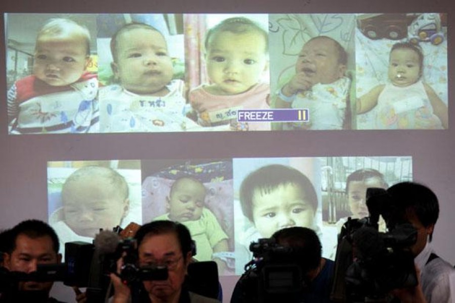 In this Reuters file photo, surrogate babies that Thai police suspect were fathered by a Japanese businessman who then fled from Thailand are shown on a screen during a news conference at the headquarters of the Royal Thai Police in Bangkok August 12, 2014. - bangkokpost.com