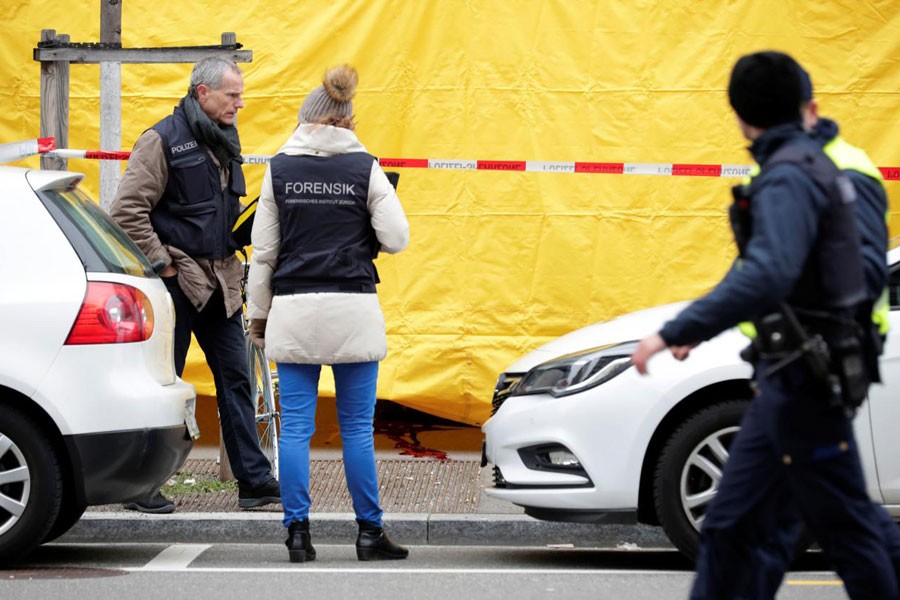 Police investigate a crime scene after two people, police said, were killed in Zurich, Switzerland, February 23, 2018. (REUTERS)