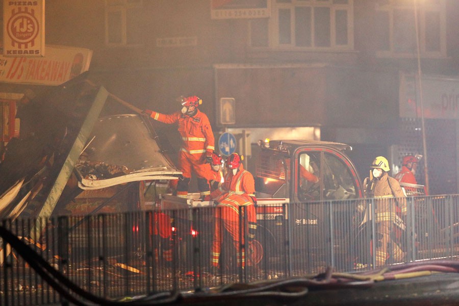 Members of the emergency services work at the site of an explosion which destroyed a convenience store and a home in Leicester, Britain, February 25, 2018. (REUTERS)