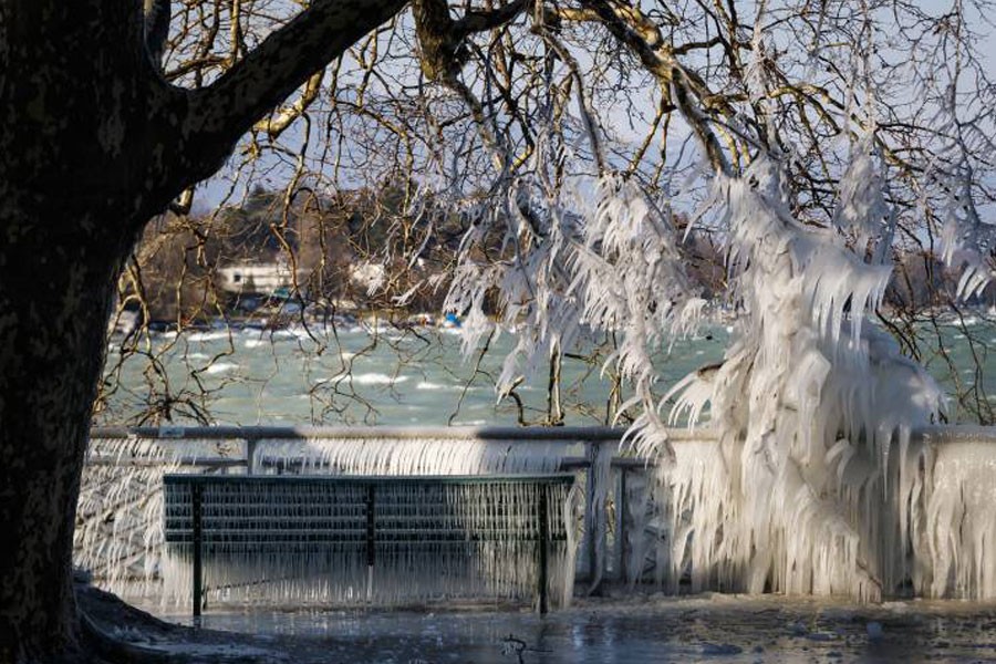 An ice-covered bench on the frozen shore of Lake Geneva during a windy winter day, in Geneva, Switzerland. (AP photo used for representation)