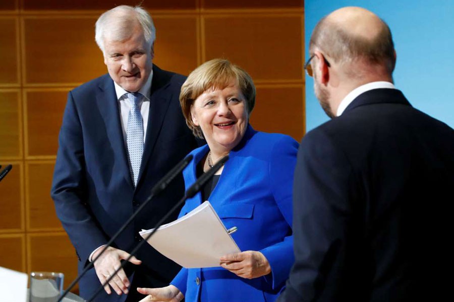 Angela Merkel with leader of the CSU Horst Seehofer and SPD leader Martin Schulz. Reuters.