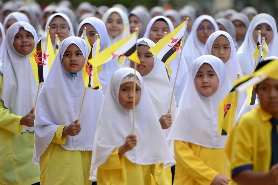 Students attend the 34th National Day celebrations in Bandar Seri Begawan, Brunei February 24, 2018. Reuters/Files