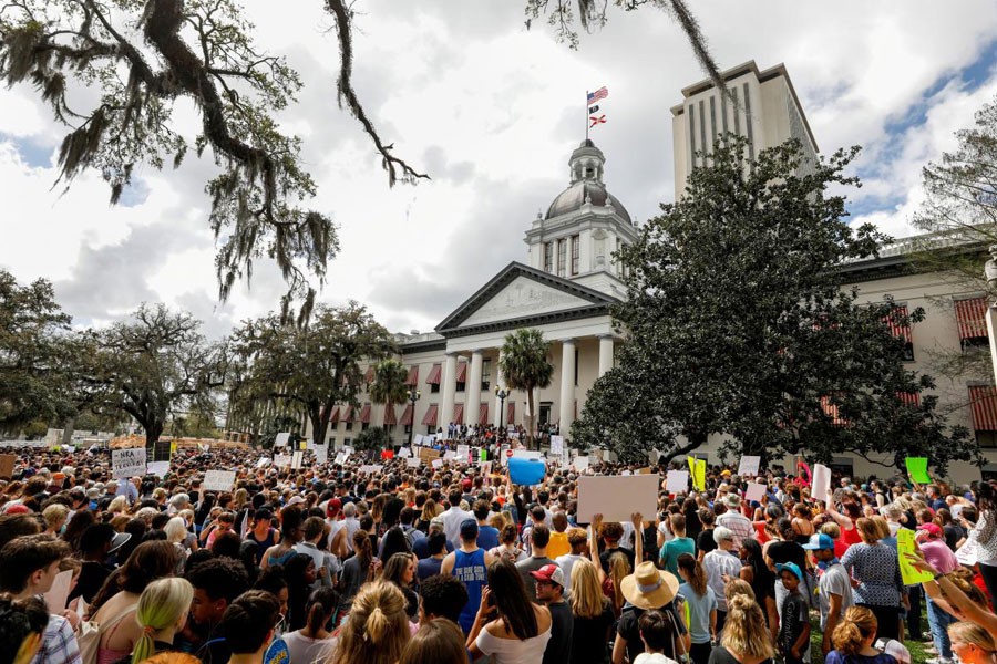 Protestors rally outside the Capitol urging Florida lawmakers to reform gun laws, in the wake of last week's mass shooting at Marjory Stoneman Douglas High School, in Tallahassee, Florida, US, February 21, 2018. Reuters.