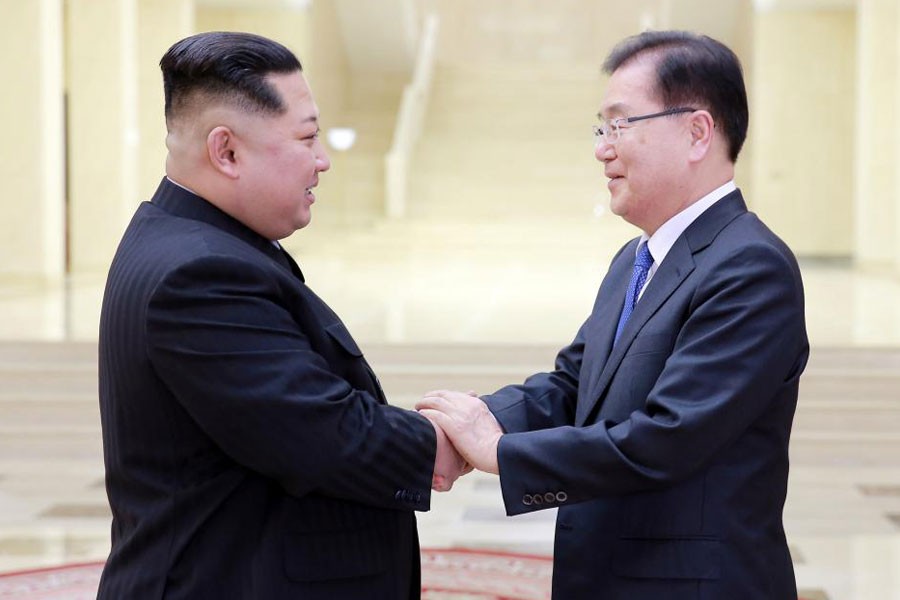 North Korean leader Kim Jong Un greets Chung Eui-yong, head of the presidential National Security Office, in Pyongyang, North Korea, March 6, 2018. Reuters.