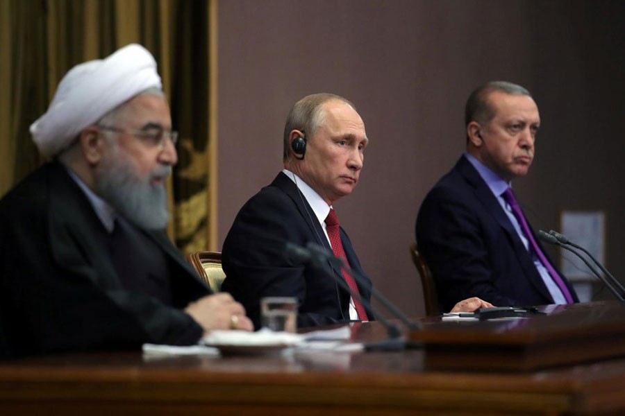 Iran's President Hassan Rouhani together with his counterparts, Russia's Vladimir Putin and Turkey's Tayyip Erdogan, attend a joint news conference following their meeting in Sochi, Russia November 22, 2017. Reuters.