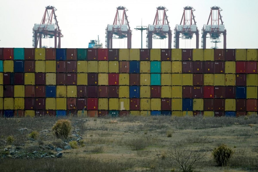 Containers are seen at the Yangshan Deep Water Port, part of the Shanghai Free Trade Zone, in Shanghai, China March 14, 2018. - Reuters