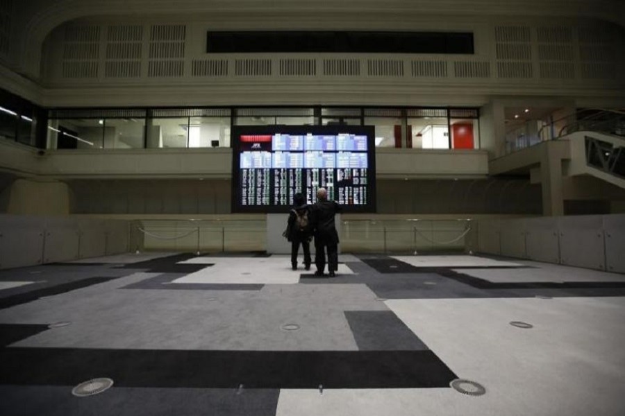 Visitors looks at an electronic board showing the Japan's Nikkei average at the Tokyo Stock Exchange (TSE) in Tokyo, Japan, February 9, 2016. Reuters/Files