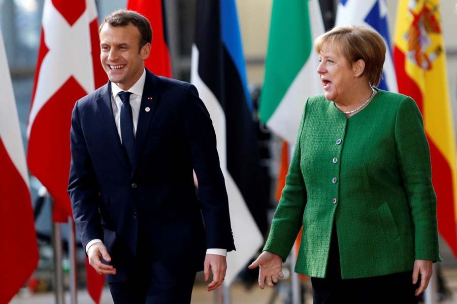 French President Emmanuel Macron and German Chancellor Angela Merkel at the European Council headquarters in Brussels on Feb 23. Reuters/File Photo