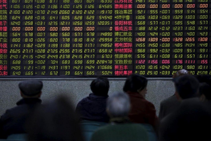 Investors look at an electronic board showing stock information at a brokerage house in Shanghai, China February 9, 2018. Reuters
