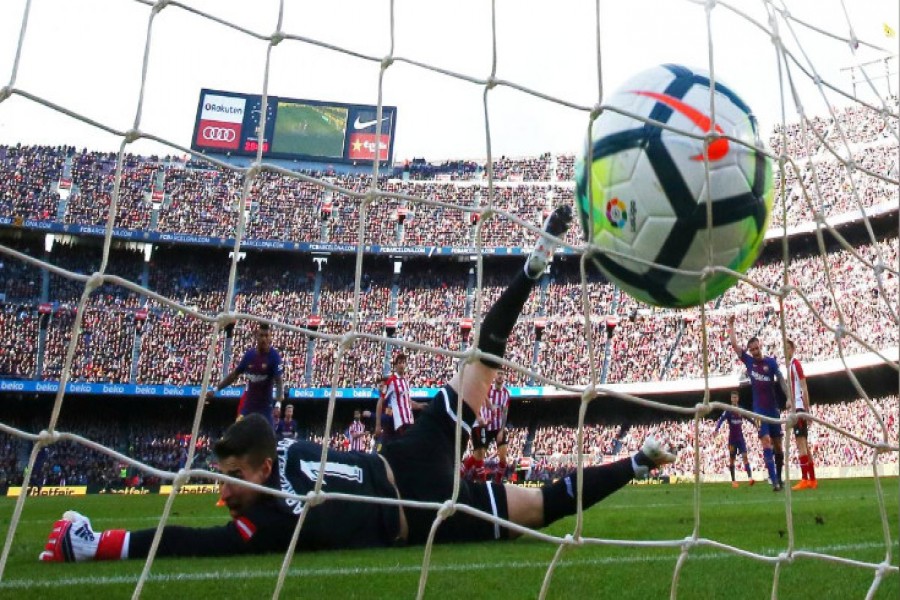Barcelona's Lionel Messi scores his team's second goal - Reuters photo
