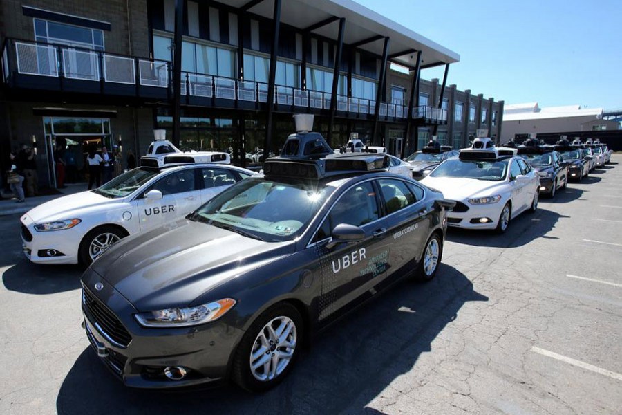 A fleet of Uber's Ford Fusion self-driving cars are shown during a demonstration of self-driving automotive technology in Pittsburgh, Pennsylvania, US on September 13, 2016 - Reuters/File