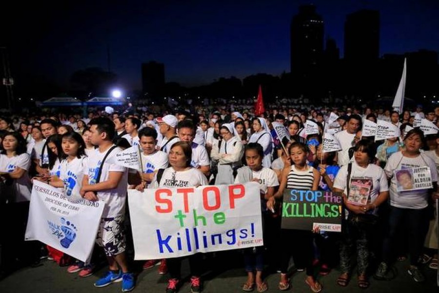 In this file photo, Participants display placards as they take part in a procession against plans to reimpose death penalty and intensify drug war during "Walk for Life" in Luneta park, Metro Manila, Philippines.  - Reuters