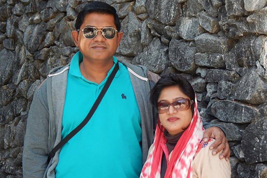 Photo shows the US-Bangla plane crash victim pilot Abid Sultan (L) with his wife Afsana Khanam