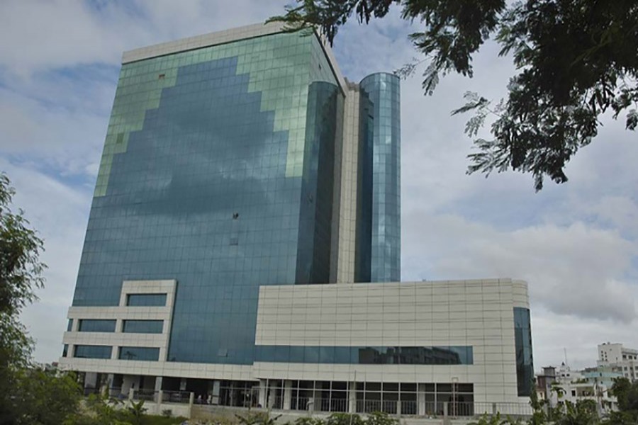 BGMEA building, illegally built on endangered wetlands in Dhaka city about two decades ago, hinders the water flow of Begunbari canal and hampers the Hatirjheel project. File Photo