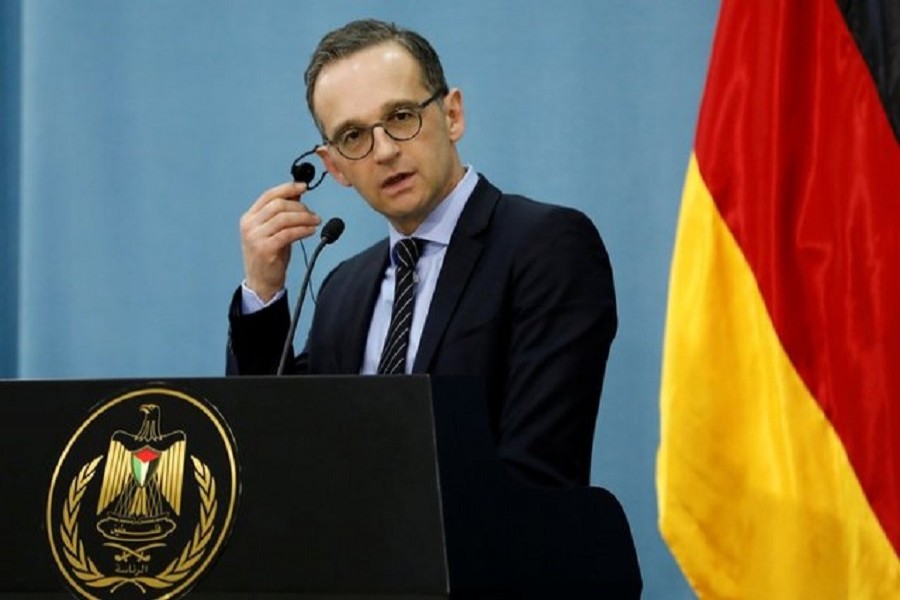 German Foreign Minister Heiko Maas listens during a news conference with Palestinian Foreign Minister Riyad Al Maliki in Ramallah, in the occupied West Bank March 26, 2018. Reuters