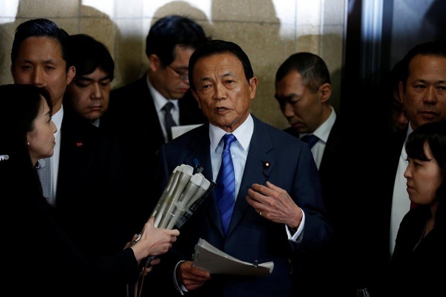 Japan's Deputy Prime Minister and Finance Minister Taro Aso speaks to reporters in Tokyo, Japan March 12, 2018. Reuters/File Photo