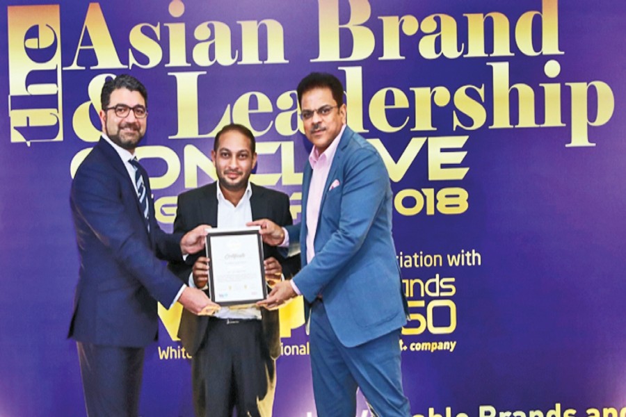 A representative of Bangladesh Edible Oil Limited receiving the 'Asia's Most Admired Brands' award at 'The Brand and Leadership Conclave' in Singapore recently
