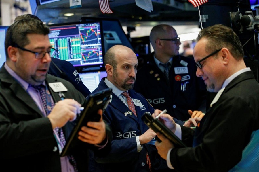 Traders work on the floor of the New York Stock Exchange (NYSE) in New York, US, March 26, 2018. Reuters