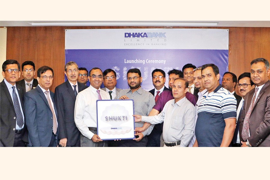 Dhaka Bank Managing Director & CEO Syed Mahbubur Rahman launching a transactional account namely 'Shukti' to benefit business enterprises at the bank's corporate office recently in presence of Emranul Huq, Additional Managing Director, Khan Shahadat Hossain and Shakir Amin Chowdhury, Deputy Managing Directors, senior executives of the bank and first five customers who opened 'Shukti Account'