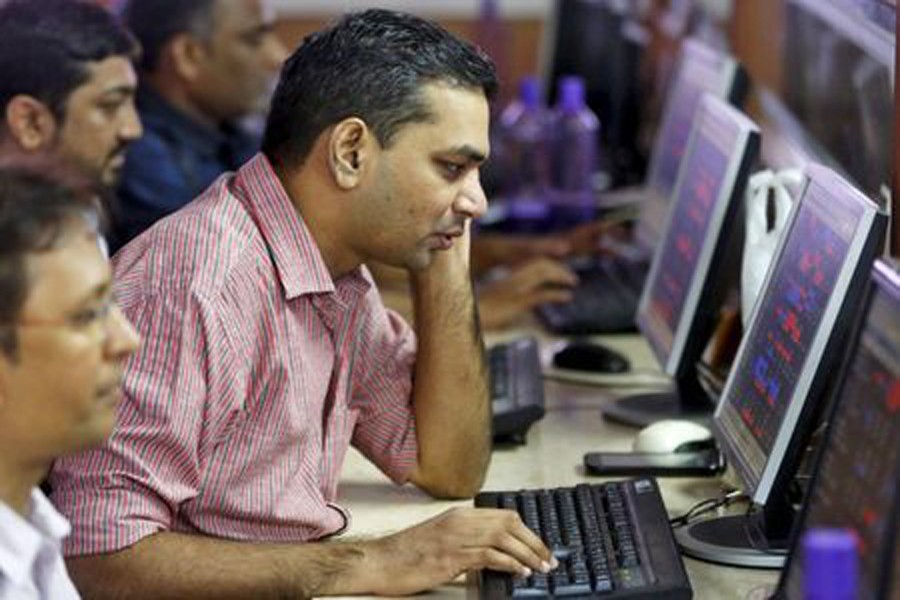 Brokers trade at their computer terminals at a stock brokerage firm in Mumbai, August 25, 2015. Reuters/File