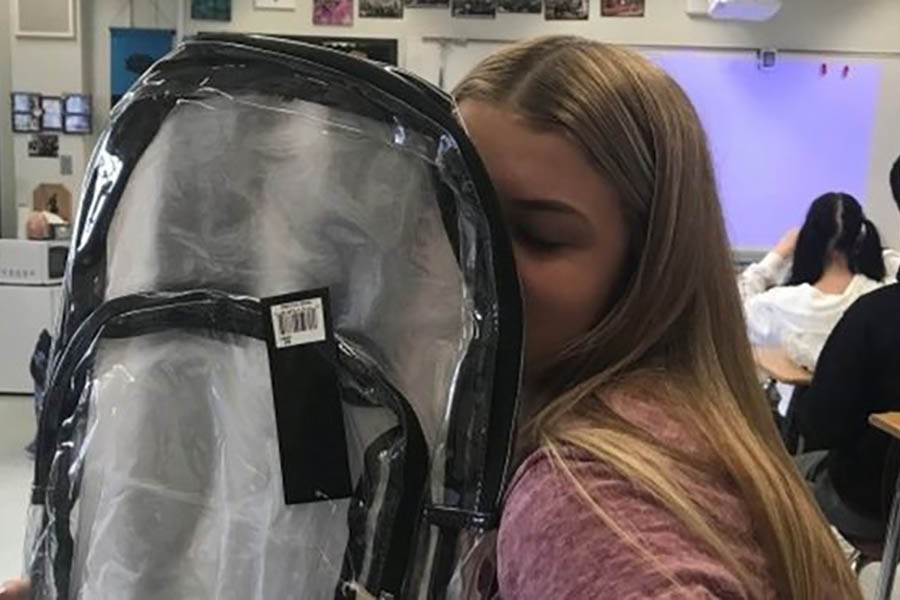 Students have to carry clear backpacks to school - Reuters