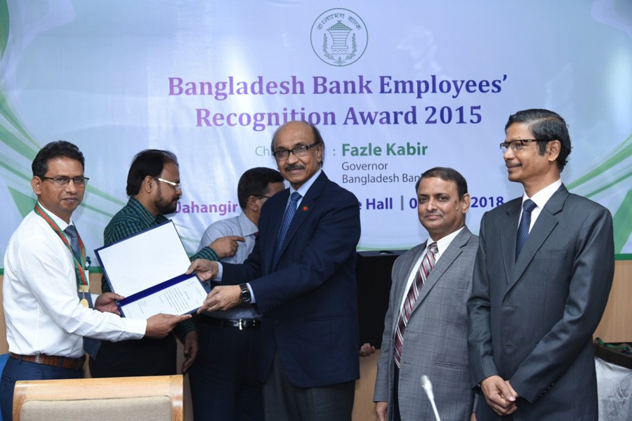 Caption: BB governor Fazle Kabir handing over the employees’ recognition award to Md Bayazid Sarker