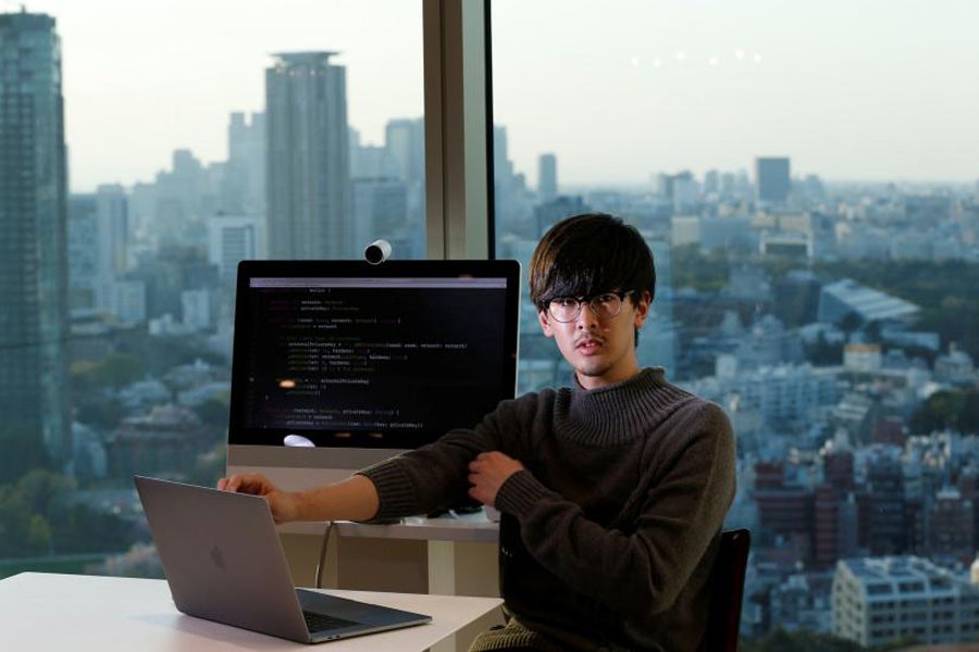 Ryo Fukuda, a software engineer at Next Currency Inc poses for a photo after an interview with Reuters at the company's headquarters in Tokyo, Japan, March 30. Reuters/File