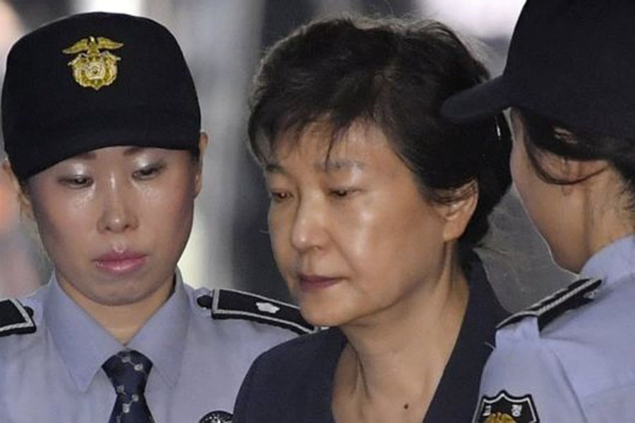 S Korea's ex-leader given hefty jail term. BBC/File