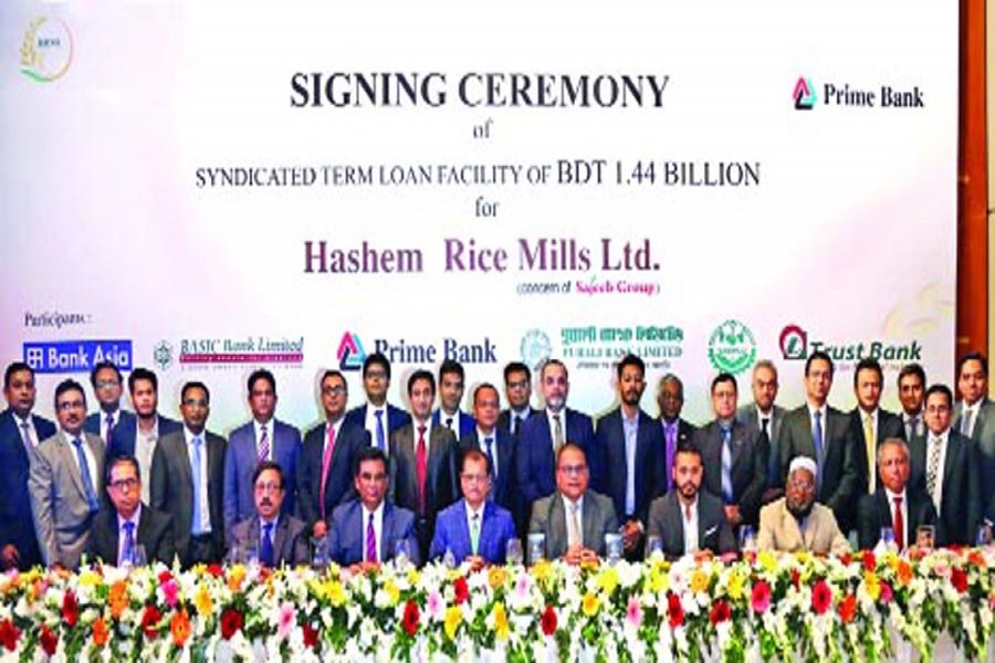 Managing Directors and CEOs of Prime Bank, Bank Asia, BASIC Bank, Pubali Bank, Trust Bank and SABINCO, sponsors of Hashem Rice Mills Limited and other senior executives of the organisations seen on the dais at a signing ceremony of a syndicated loan of Tk 1.44 billion in the city recently