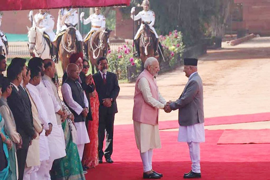 Indian Prime Minister Narendra Modi (left) and Nepalese Prime Minister KP Sharma Oli shaking hands at a ceremony in New Delhi recently	— Reuters