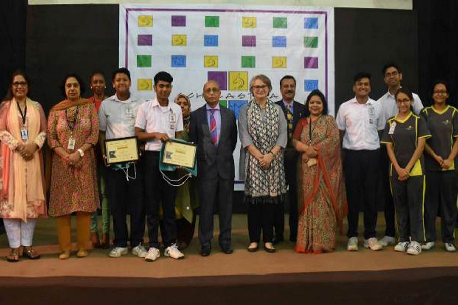 Students along with faculties of Scholastica school pose for photograpgh after winning 'Film Fly Experience Australia' competition. UNB Photo