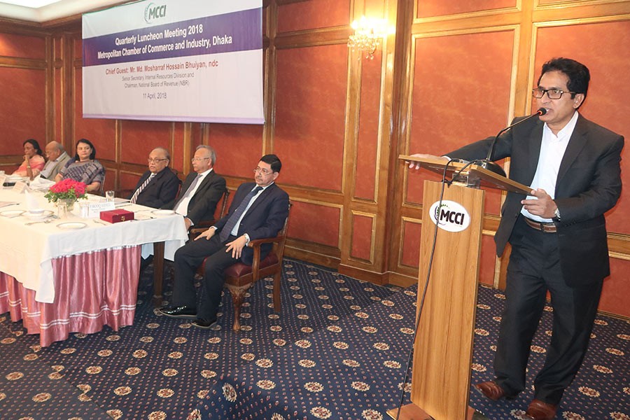 NBR Chairman Mosharraf Hossain Bhuiyan speaking at a quarterly luncheon meeting of the Metropolitan Chamber of Commerce and Industry, Dhaka (MCCI) in the city on Wednesday, with MCCI President Nihad Kabir in the chair — FE Photo