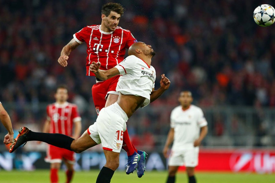 Champions League Quarter Final Second Leg - Bayern Munich vs Sevilla - Allianz Arena, Munich, Germany - April 11, 2018 Bayern Munich’s Javi Martinez in action with Sevilla’s Steven N’Zonzi. Reuters.