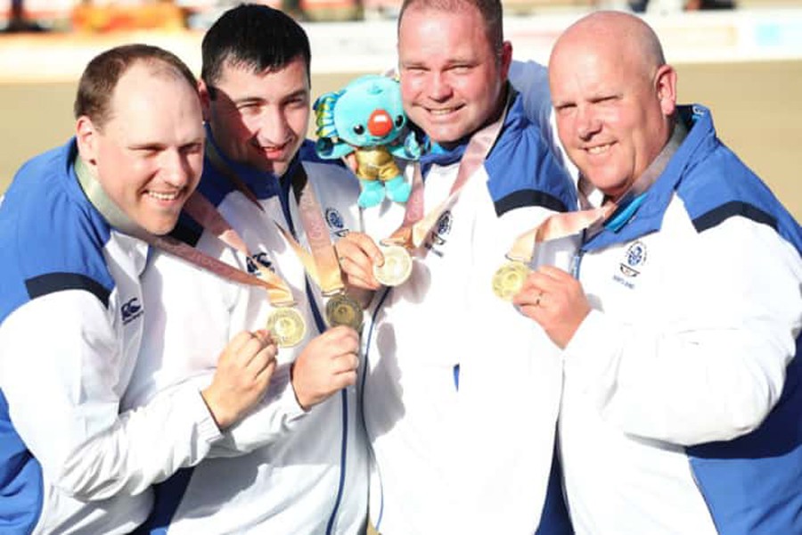 Ronald Duncan, Derek Oliver, Paul Foster and Alex Marshall celebrating the gold	— Internet