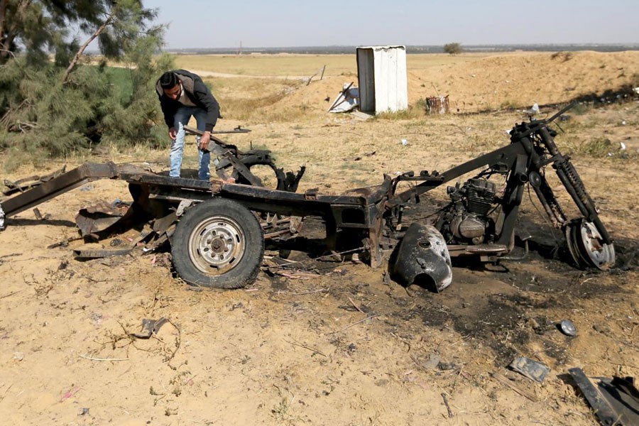 A Palestinian man looks at the scene of an explosion in the southern Gaza Strip, April 14, 2018. Reuters.