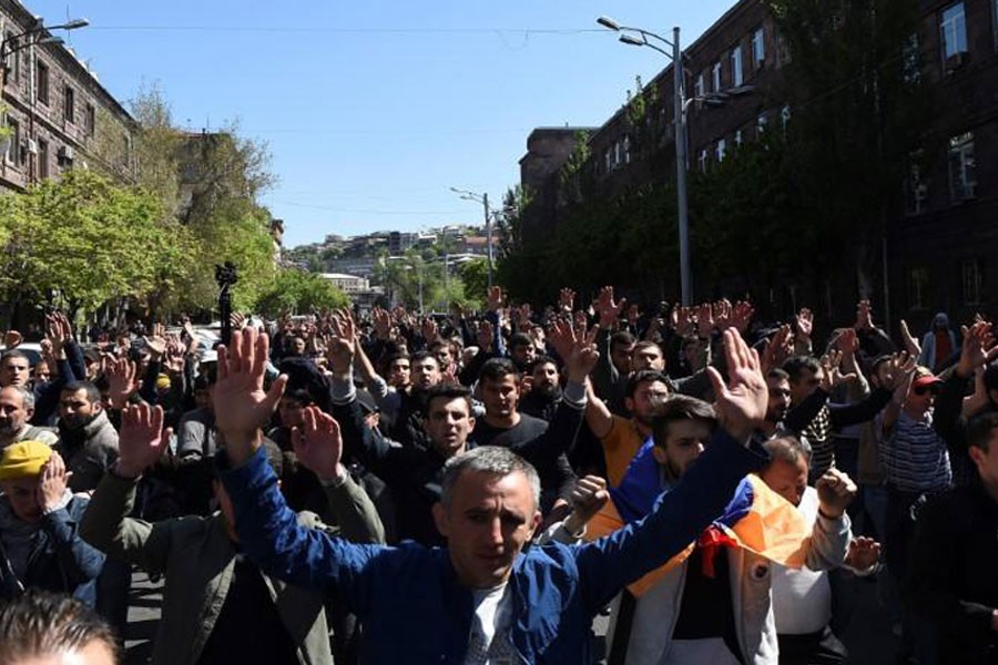 Demonstrators attend a protest against Armenia’s ruling Republican party’s nomination of former President Serzh Sarksyan as its candidate for prime minister, in Yerevan, Armenia April 16, 2018. Reuters.