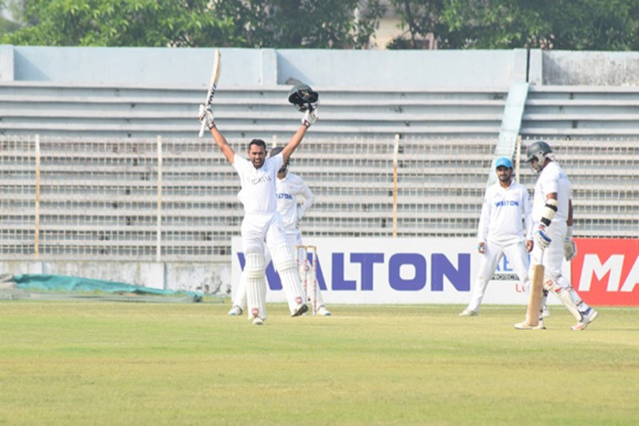 Central Zone's batsman Mohammad Mithun celebrating after hitting a century against South Zone after the 3rd day of the 5th round four-day match of BCL at Shaheed Kamruzzaman Stadium in Rajshahi on Thursday 	— bdnews24.com